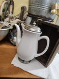 White Pitcher with Silver Lid and Base.